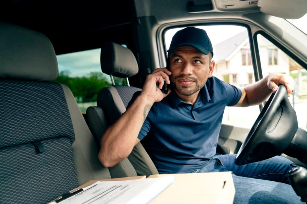 driver with package looking away while sitting in 2024 11 26 21 35 03 utc
