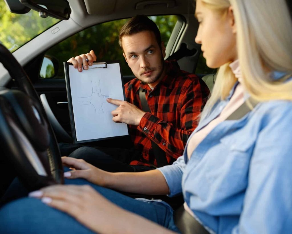 woman-and-man-with-checklist-driving-school-1.jpg